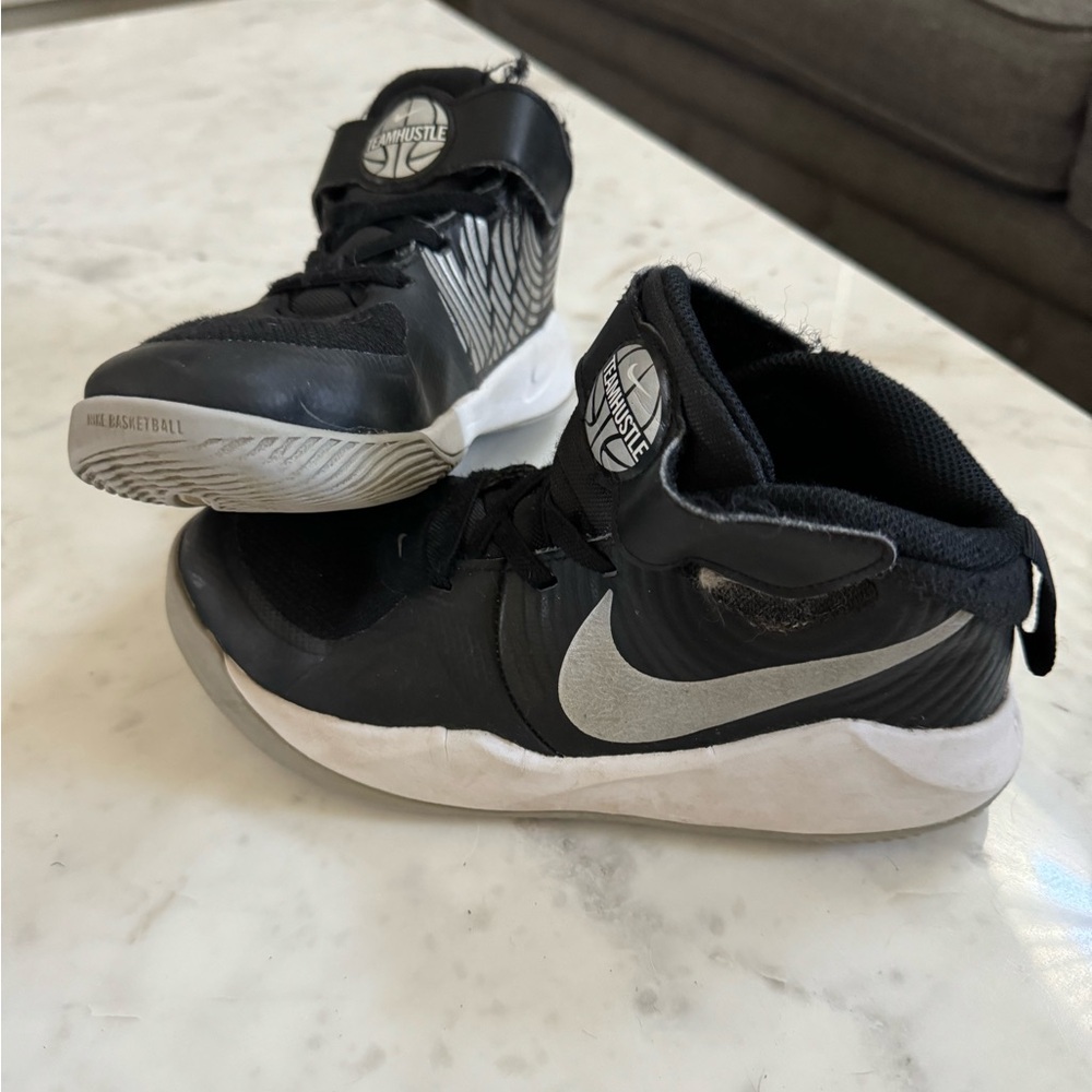 Nike high tops. Velcro closure. Black with silver. Big boys size 3.